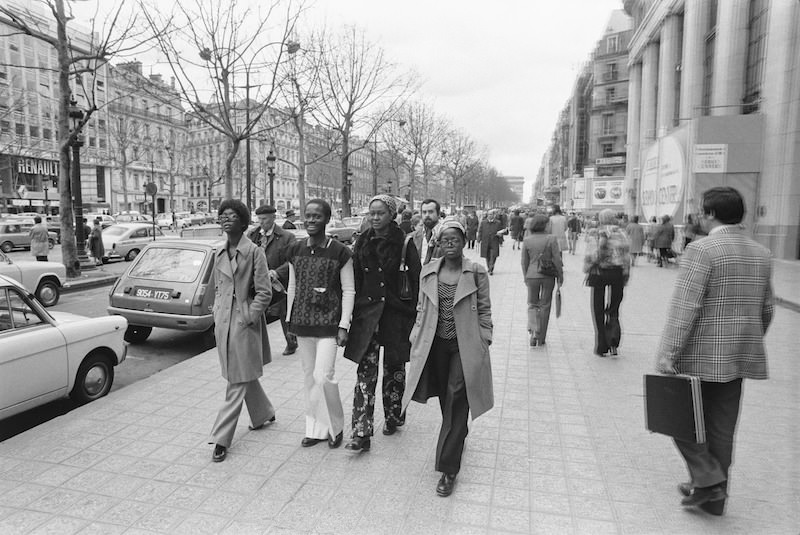 Pedestrians in the streets of Paris, France in 1973